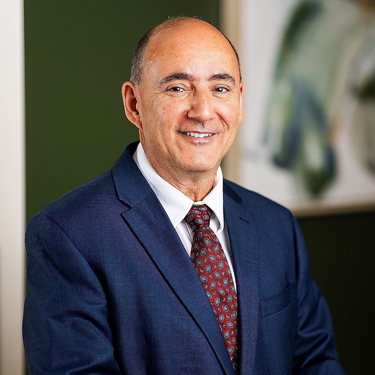 Man in a suit smiling professionally